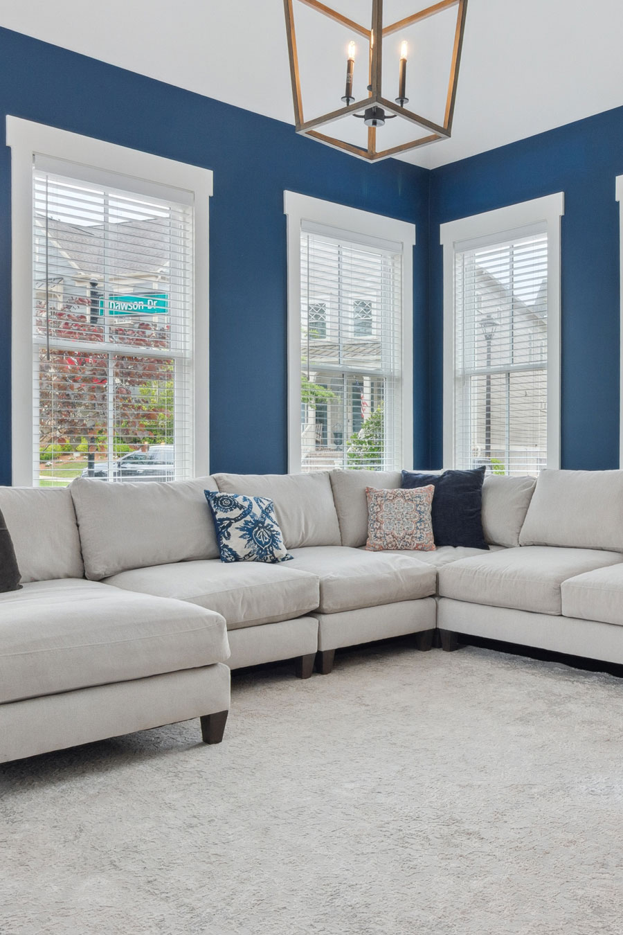Bright and inviting kitchen in Acworth, Georgia featuring sleek white cabinets, elegant granite countertops, and modern stainless steel appliances, complete with a stylish breakfast bar and comfortable bar stools for casual dining.
